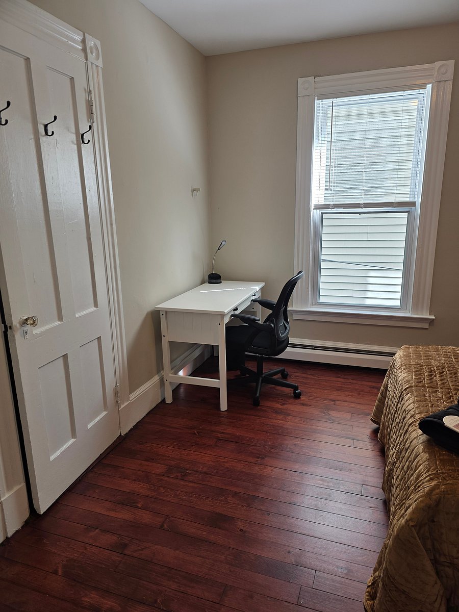 desk, lamp and chair in middle bedroom