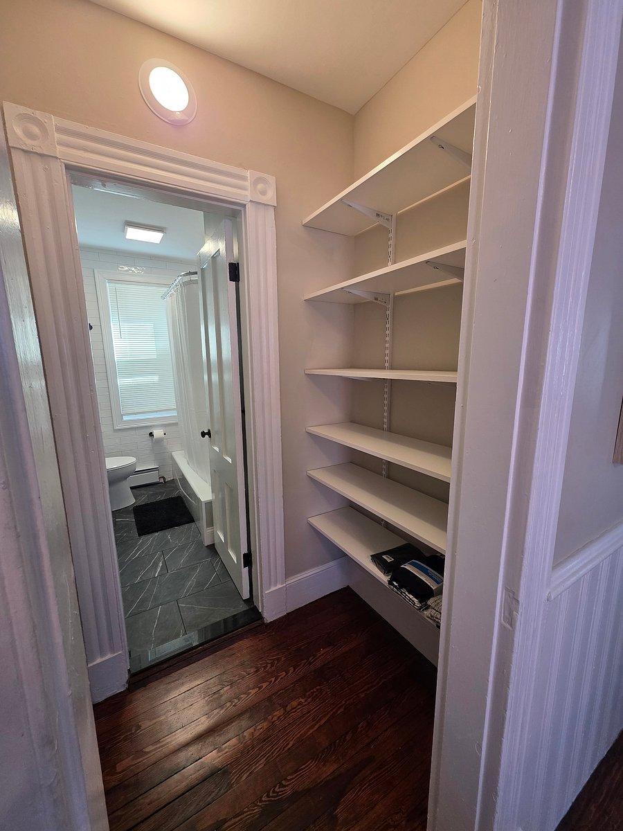 pantry as you enter the bathroom, shelves on both sides provide lots of storage