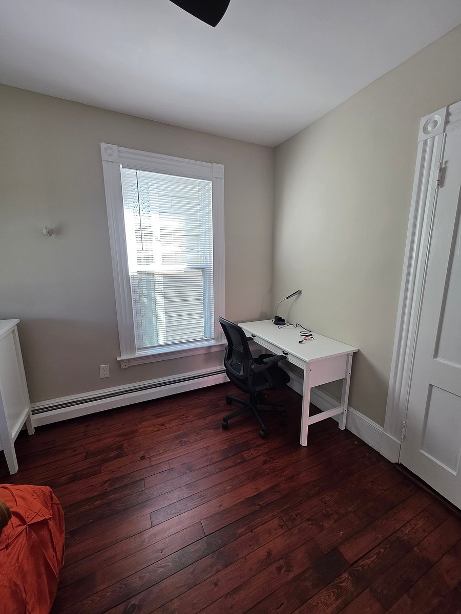 desk and chair in middle bedroom