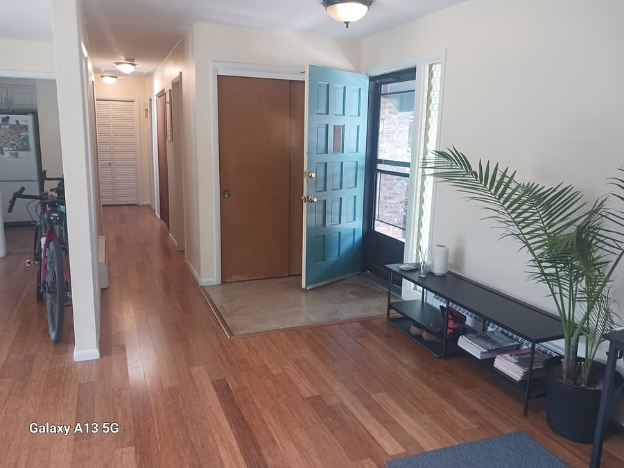 Entry way and hallway to bedrooms, kitchen and dining area is on the left