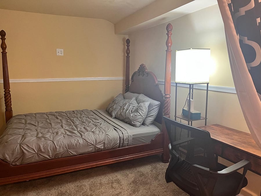 Self contained private basement with an office table and chair ready for you to do your important work.