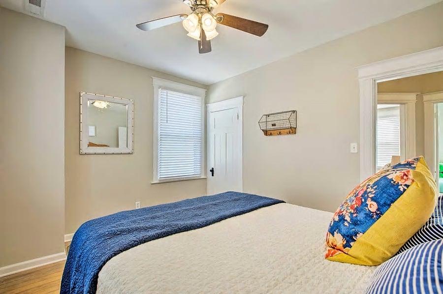 Bedroom 2 on second floor with queen bed and closet.