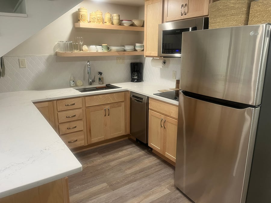 Fully stocked kitchen. All new appliances including full size fridge, convection/microwave, and dishwasher!