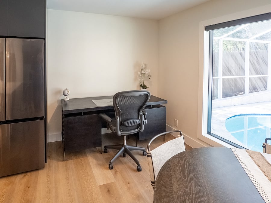 work area off kitchen overlooking pool