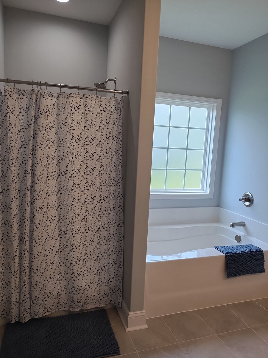 Master bath features a shower and battub