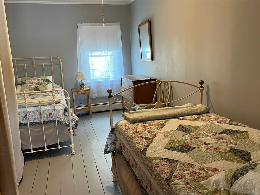 The third bedroom has two twin beds, bureau and closet. The linen closet is also in this room.