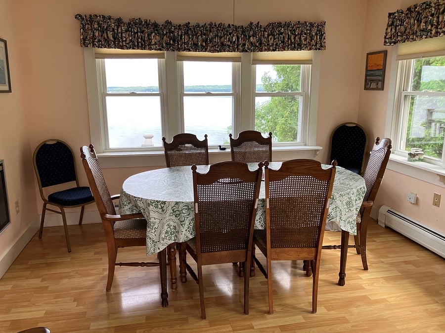 Sunroom/dinning room with view of the bay.
