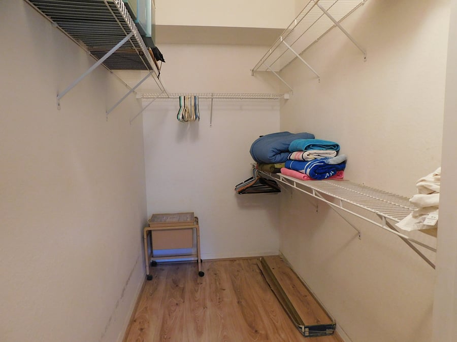 Walk in closet in primary bedroom