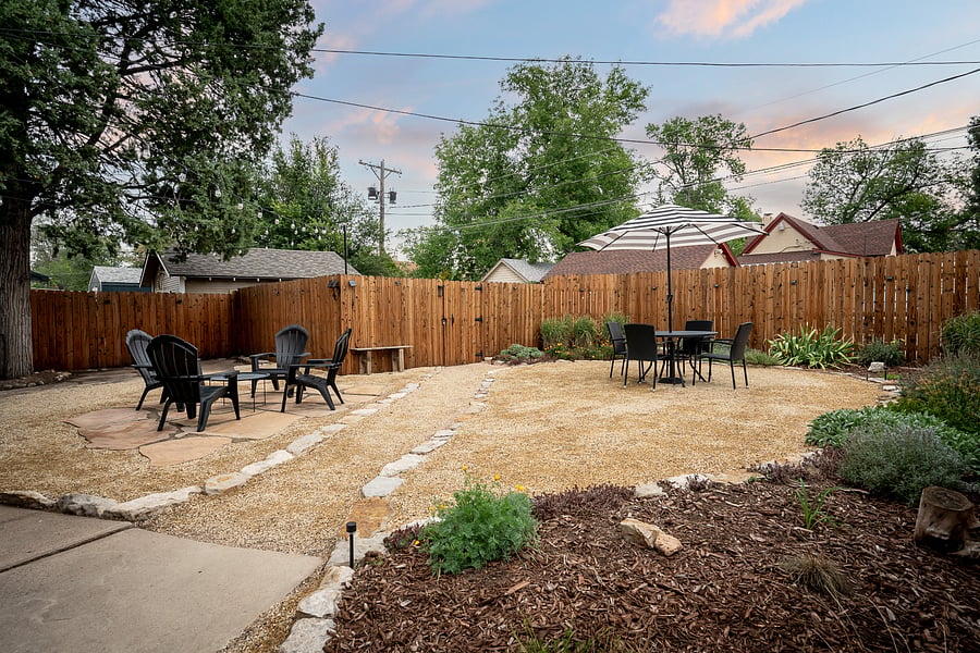 The backyard provides a great retreat with plenty of sun, space and seating to hang out or entertain. Umbrella, seating and tables included!