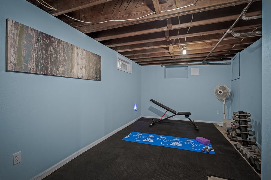 A fitness area to sweat, breath heavy, pick up and put down heavy things is here if you need it. Adjustable bench, yoga mat, padded flooring and dumbbells all included!