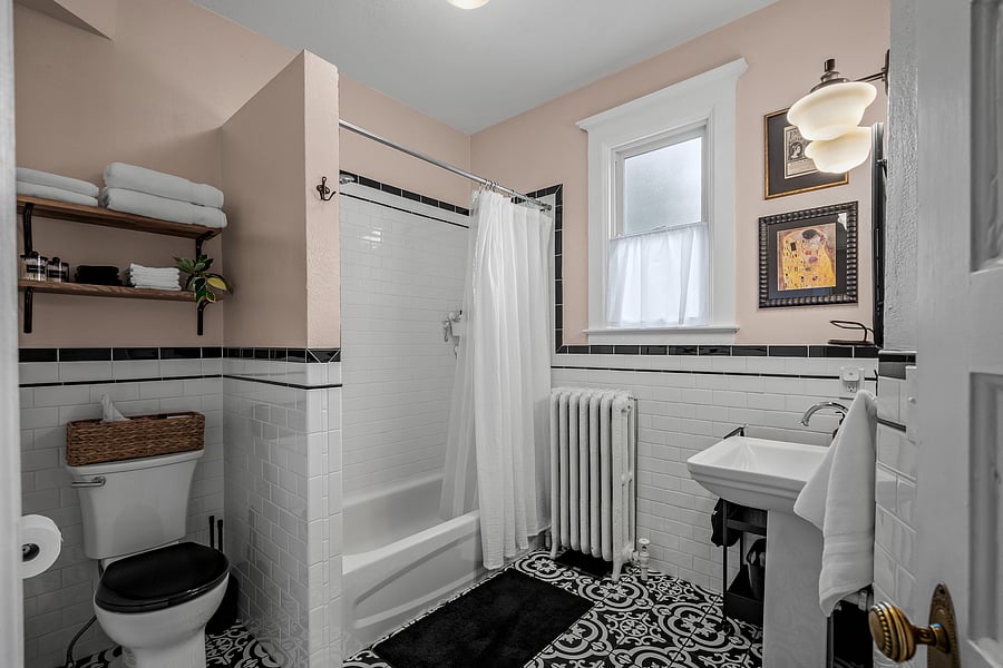 The beautifully updated full bathroom provides a delightful sanctuary for your bathing needs whether taking a hot shower/bath after a long work day or prepping for a night out. Bath, face and makeup towels, hair dryer and starter toiletries are included!