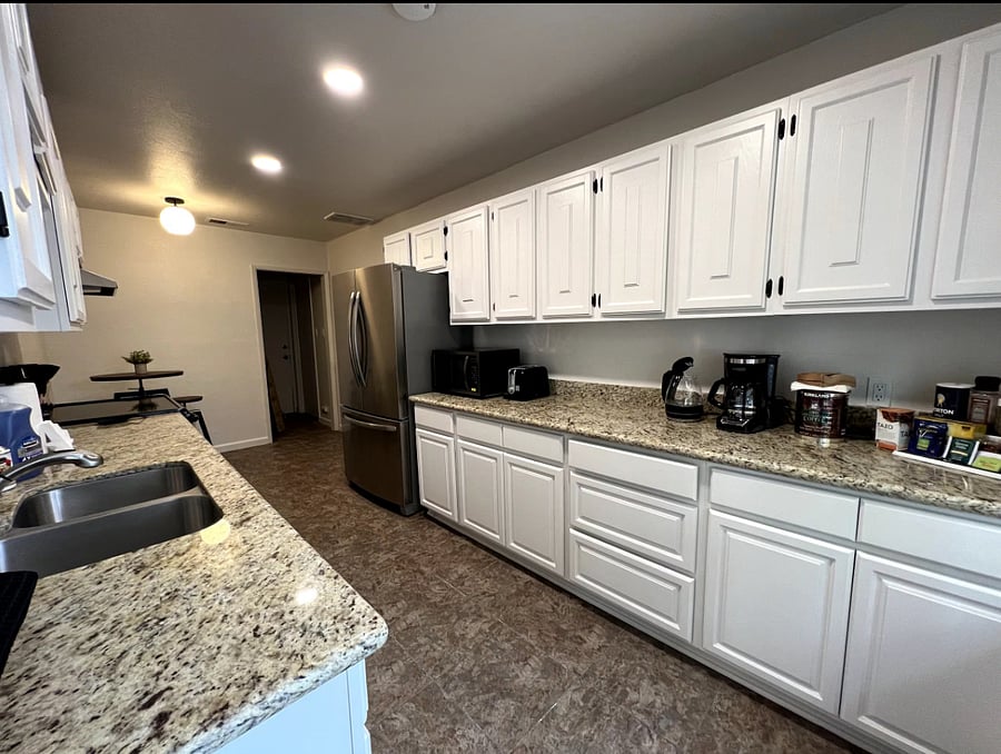 Full kitchen with fridge, microwave, toaster, coffee maker, sink, stove, oven, table with 2 chairs, etc.