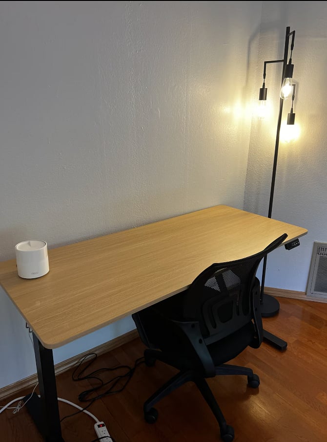 Height adjustable work desk in living room