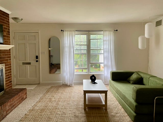 The living room has a large sunny window facing the complex's courtyard/greenspace. The fireplace may be used to burn candles for great ambiance