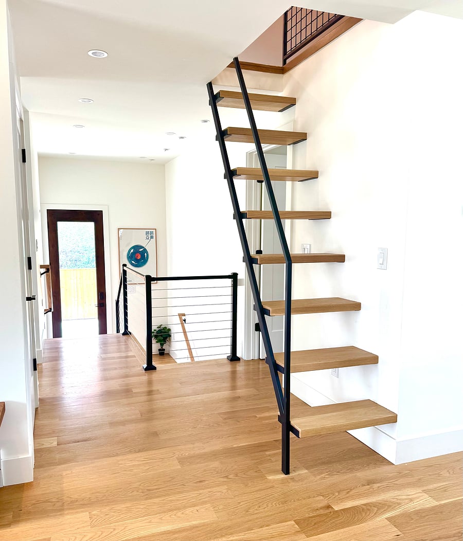 Upstairs hallway to basement, side door and loft stairs