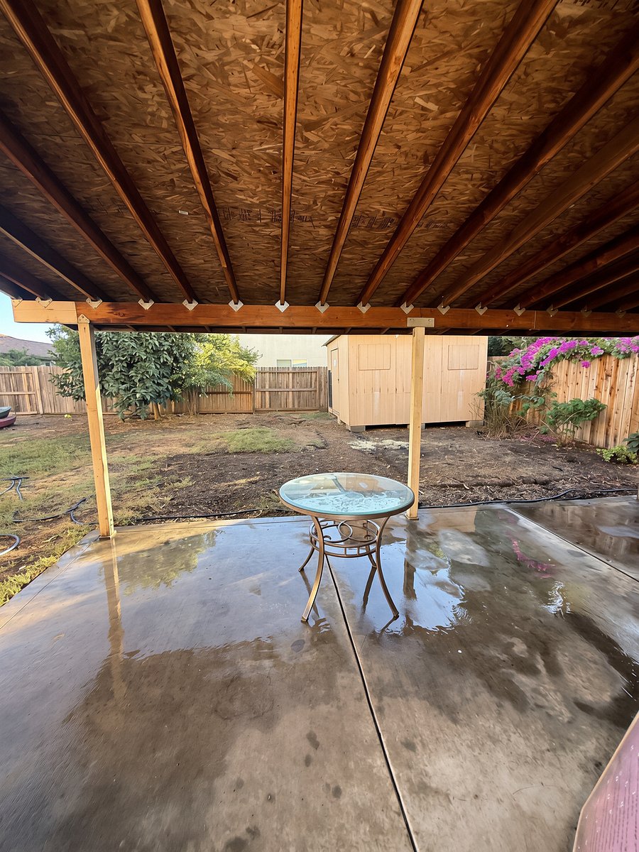 Covered patio with blooming flowers and pomelo fruit tree (outdoor chairs have been added)