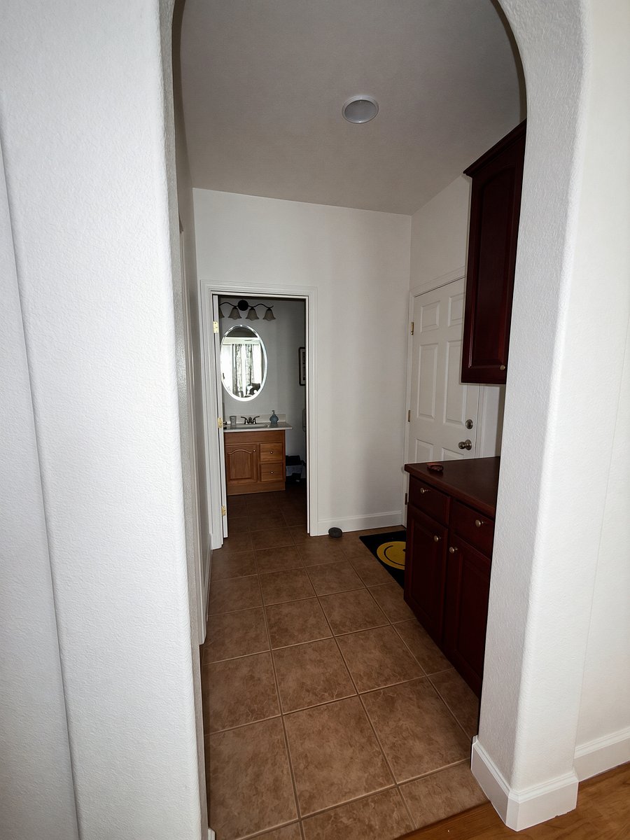 1st floor entrance to garage and 1/2 bath