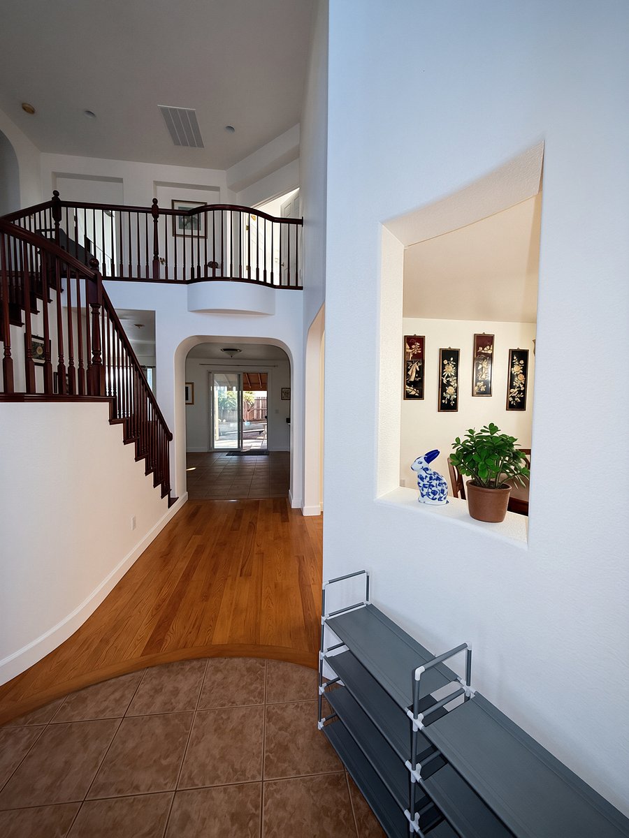 Walkway to 2nd living room, kitchen, and formal dining room