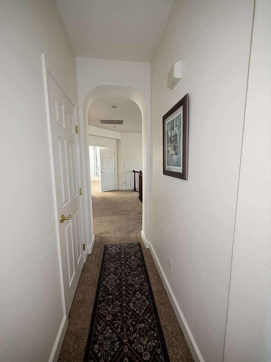 Hallway to the bedrooms, shared bath, and laundry