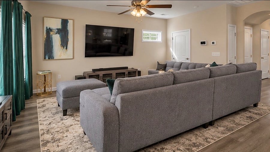 Virtually Staged: Photos are provided to illustrate the living room's layout and potential furniture arrangement. Actual furnishings may vary and will be in place prior to tenant move-in.