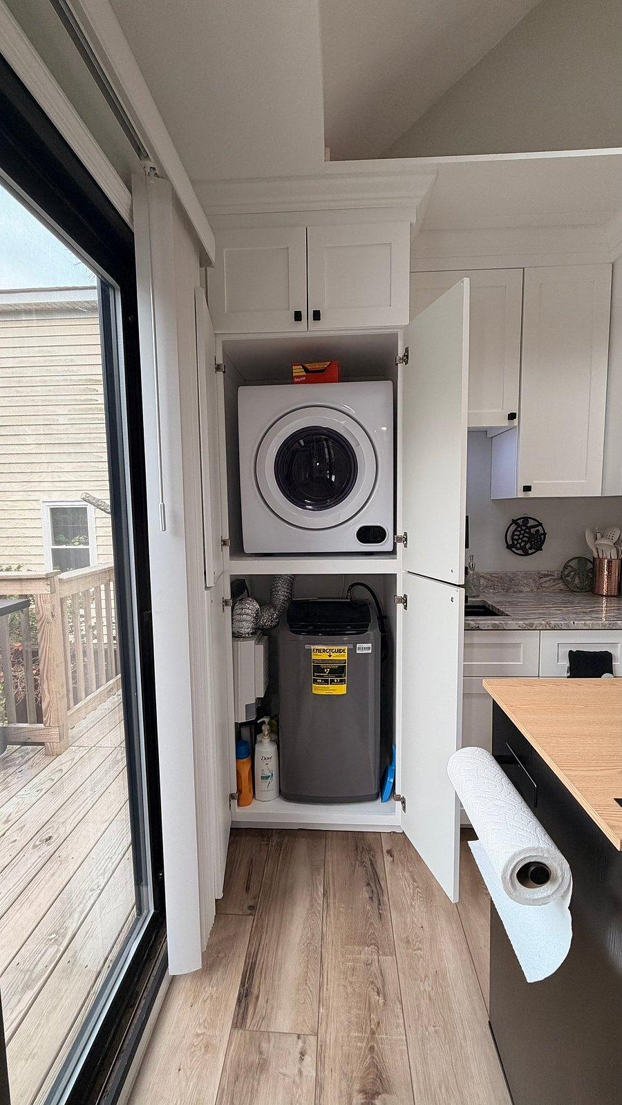 Laundry closet includes a washer and dryer.