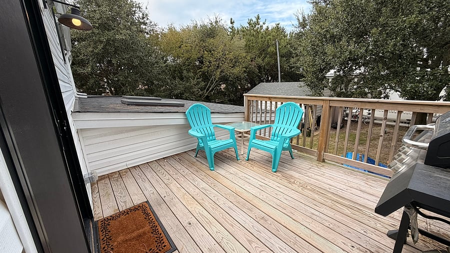 The walkway headed to the beach is where the tree line is in the back of the photo. 10x12 deck to enjoy and bar-b-que on.