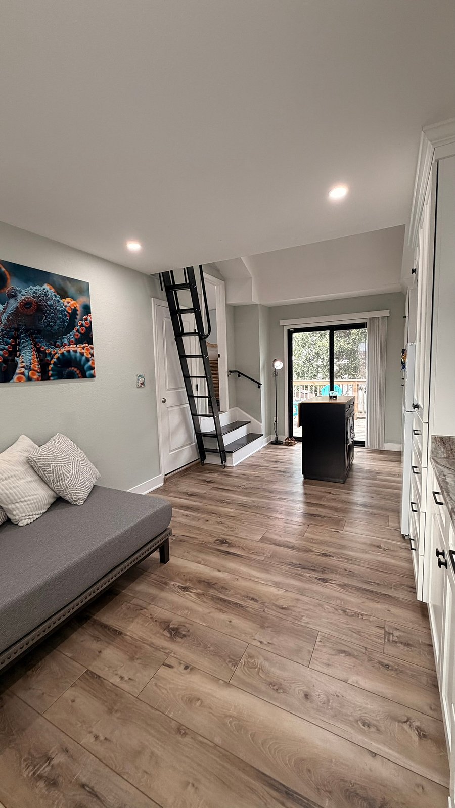 Photo from living space through kitchen to back/entry door.