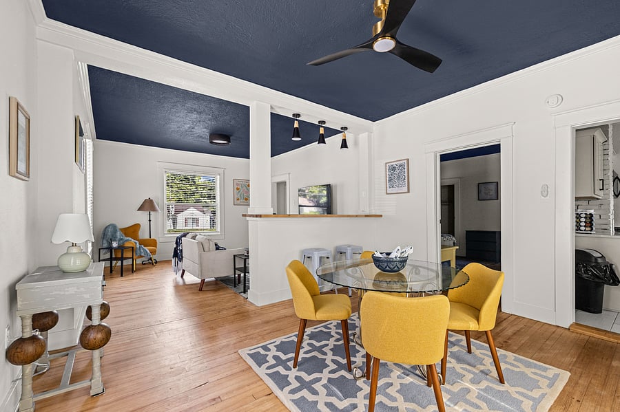 The dining area is adjacent yet separated from the living area and is easily accessed from the kitchen and main bedroom.