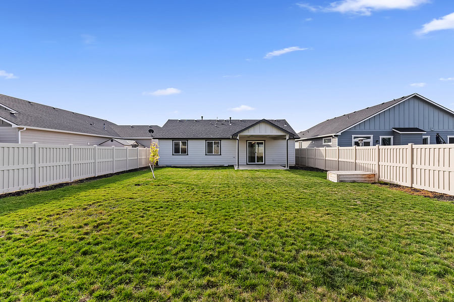 Fully fenced yard, patio cover and an in ground garden box for use if needed.