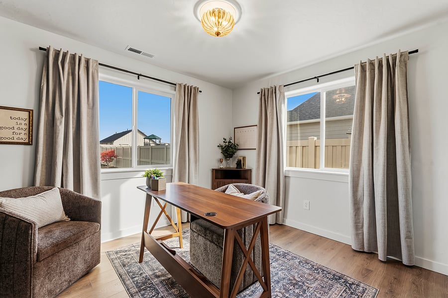Designated office space with 2 chairs, blackout curtains and an extra closet space.