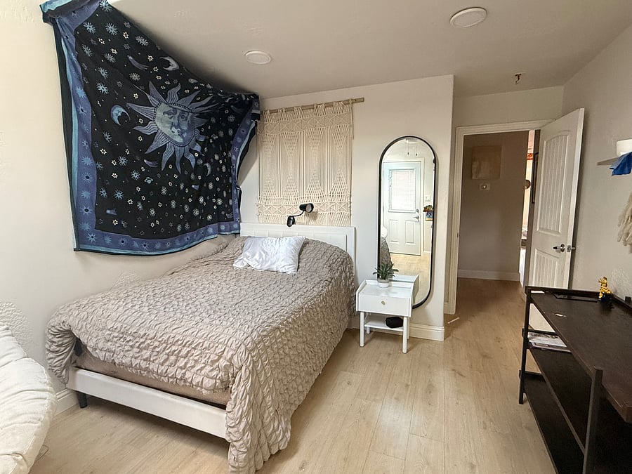 Downstairs bedroom with attached bath and separate entry way