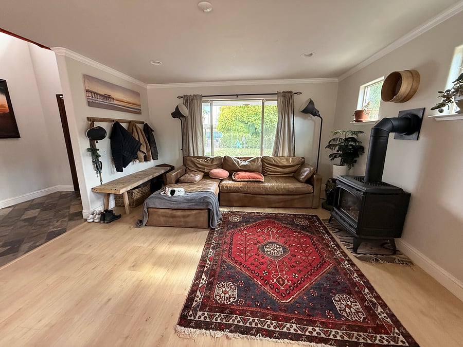 Living room with gas fireplace attached to dining room