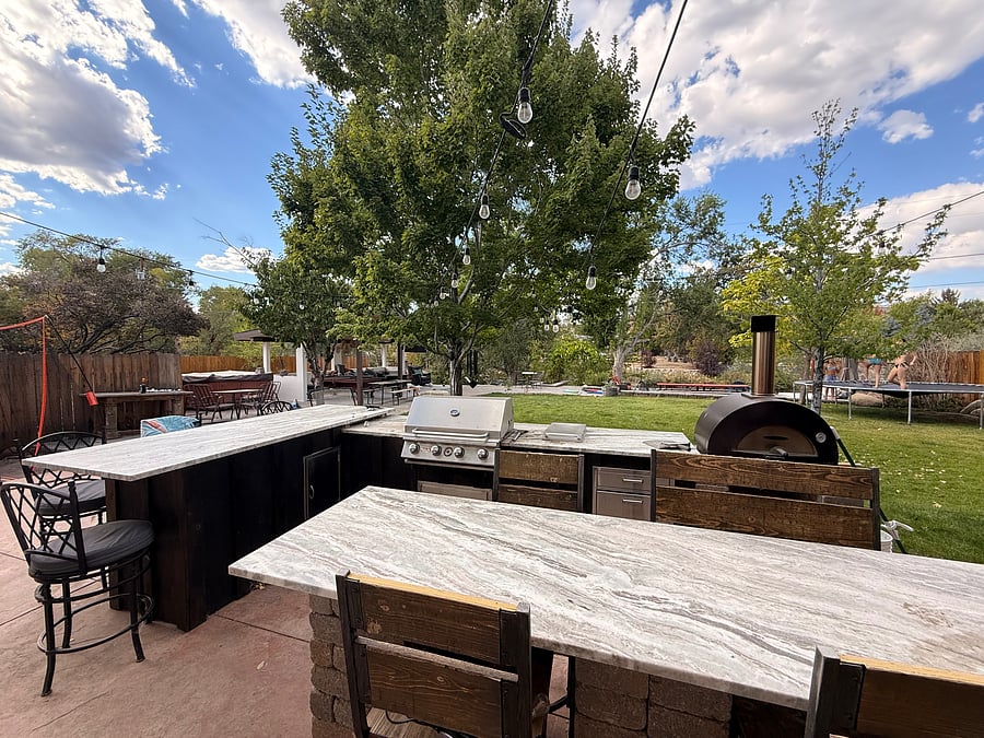 Outdoor dinning and cooking area, Blackstone/grill, Italian pizza oven and separate traeger