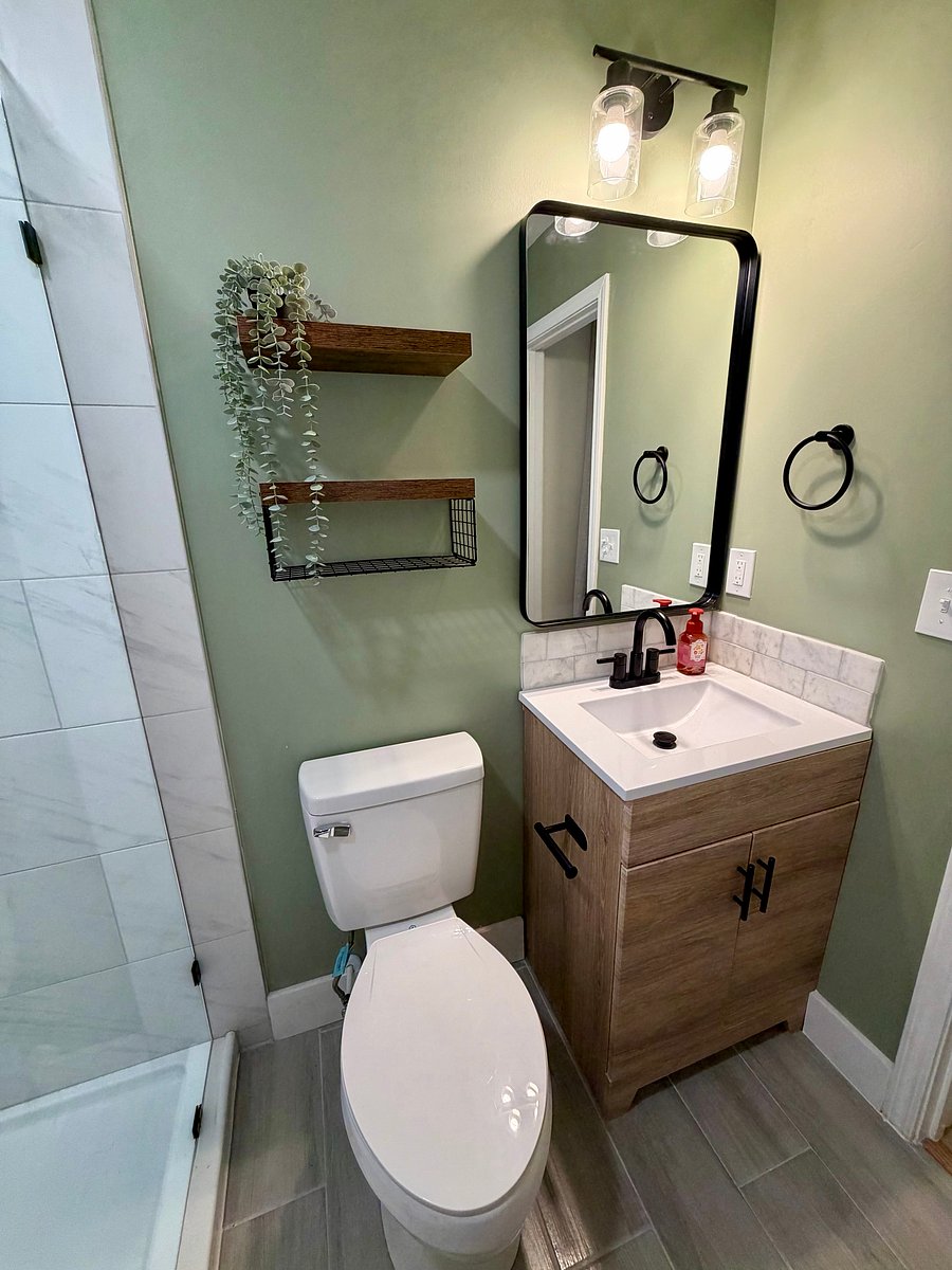 Newly renovated kitchen with tiled shower.
