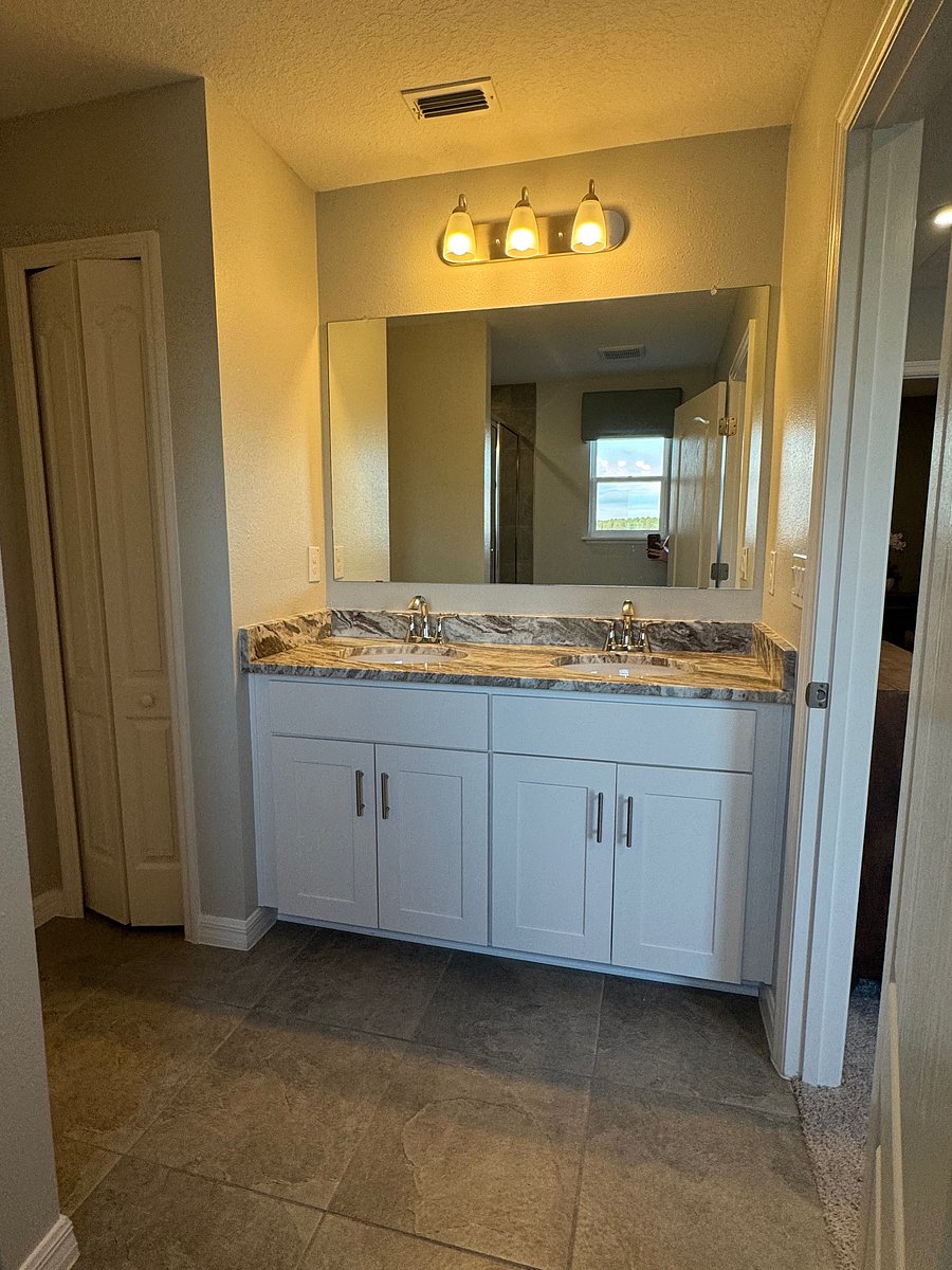 Primary Bath with dual sinks and walk in shower.