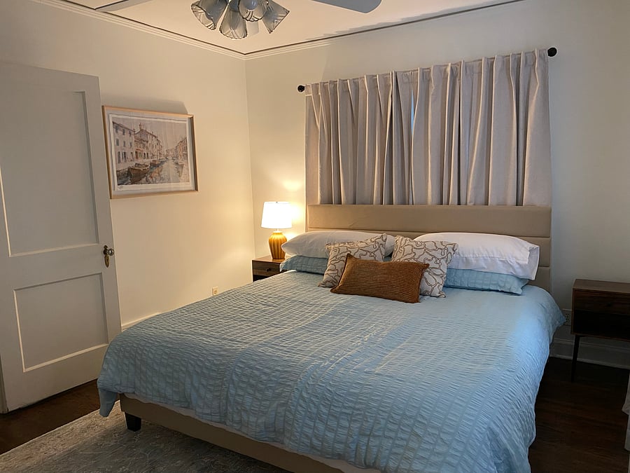 Main bedroom with king mattress. Large dresser and mirror. Walk-in closet. This bedroom is on front/west side of house.
