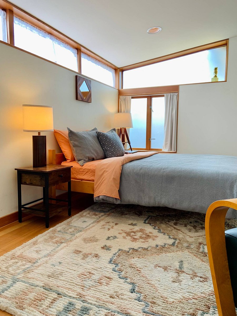 Master bedroom with queen sized bed and private sitting area.