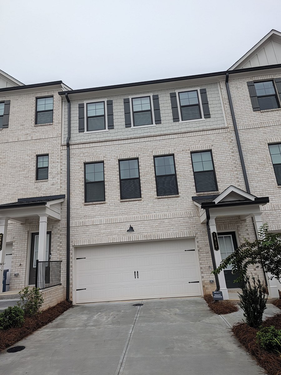Front of home, with main entrance and driveway parking.
