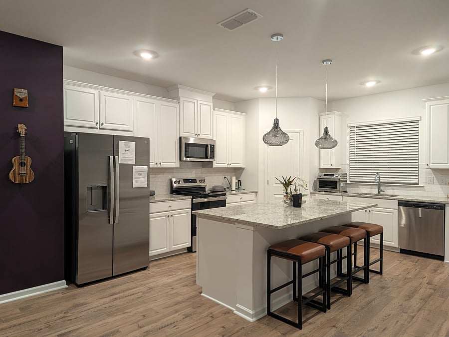 view to main kitchen from living room
