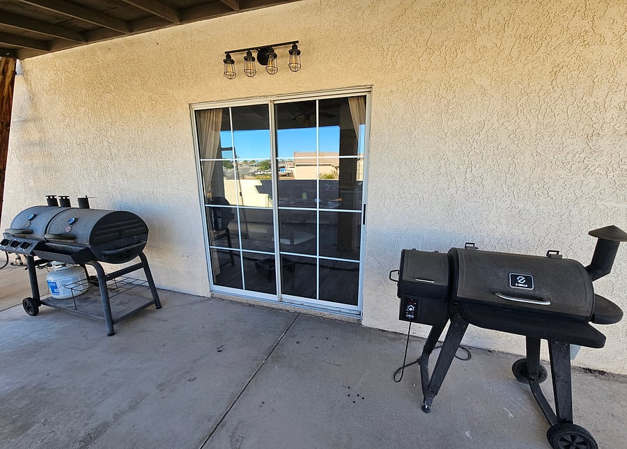 Pellet smoker on the right, charcoal barbecue on the left.  The propane regulator has malfunctioned and not safe to use.