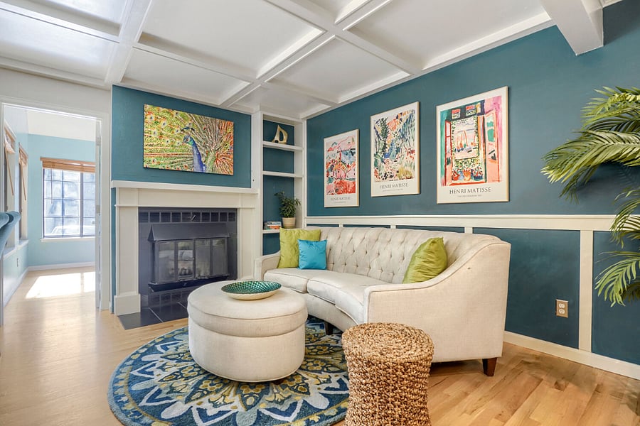 Living Room  A warm, inviting retreat featuring a cozy wood-burning fireplace, custom built-in bookshelves, and timeless architectural detail.