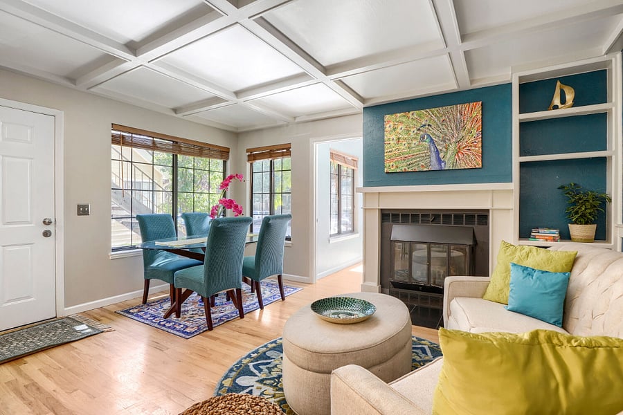 Living & Dining Room  A welcoming, thoughtfully designed space with distinct areas for gathering, dining, and relaxing, all connected by warm hardwood floors and an inviting sense of flow.