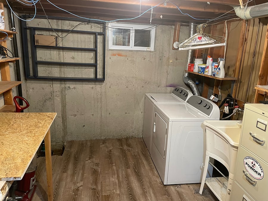 Laundry room with washer, dryer, utility sink and folding table