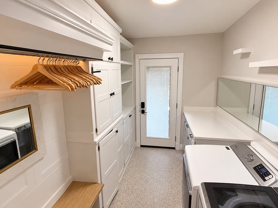 Your private entrance into a spacious laundry room, and is one of two closet spaces for you 