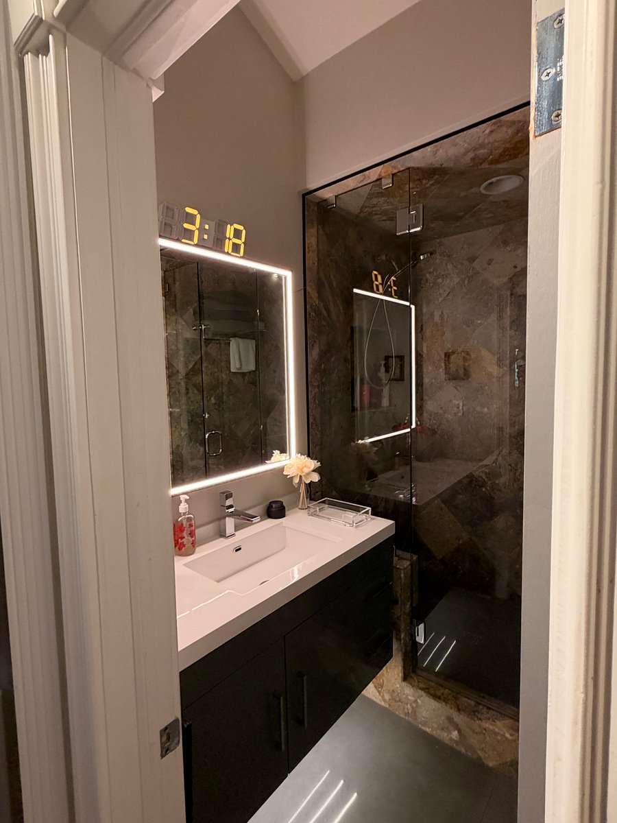 Your sink and walk in shower with bench