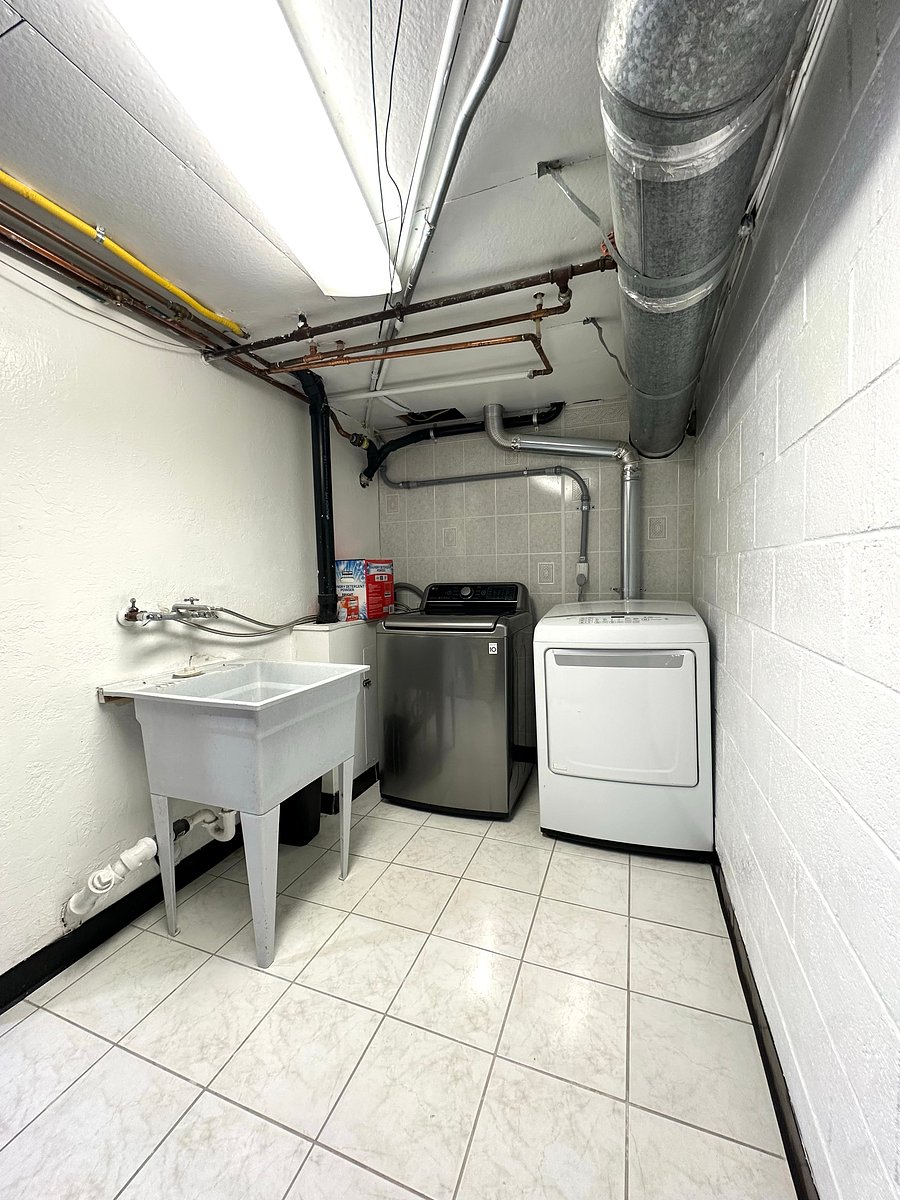Laundry room located downstairs.