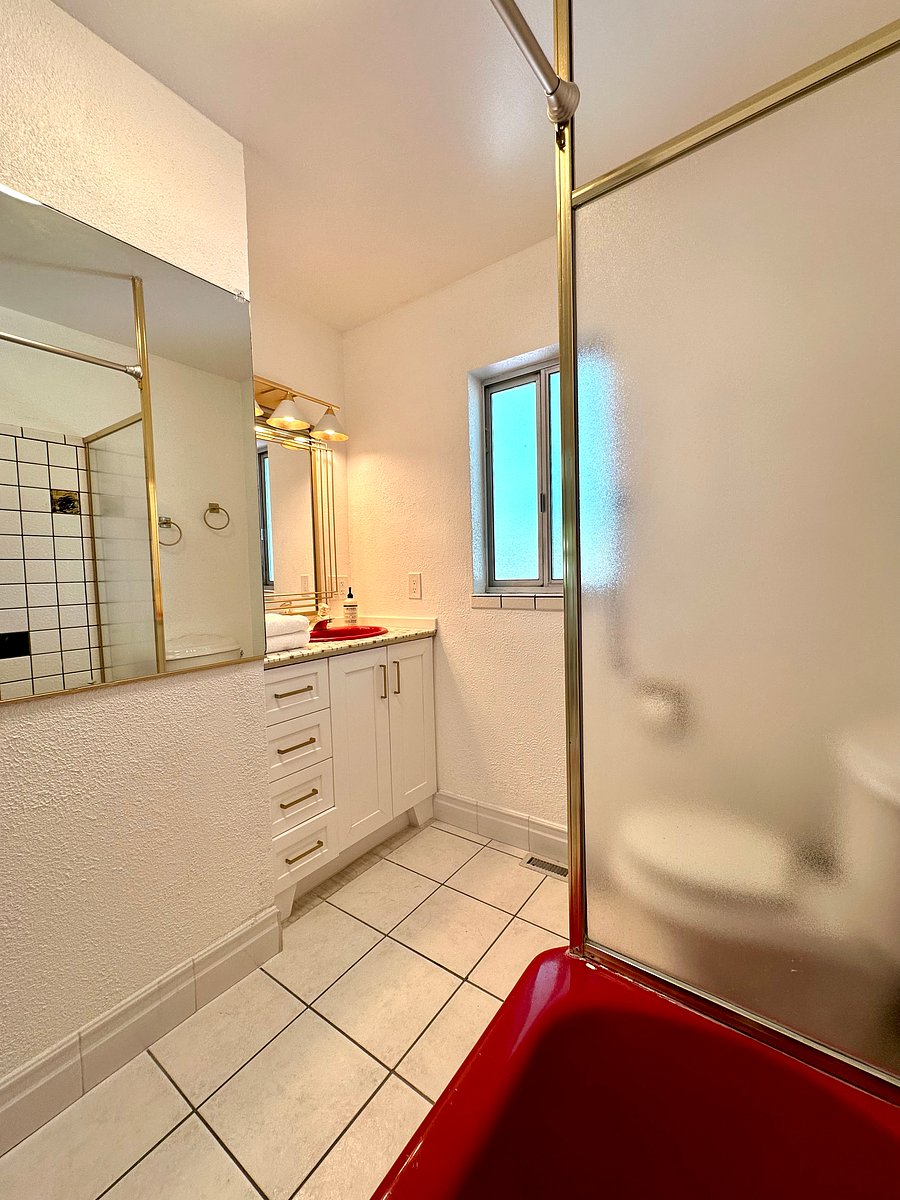 Full bathroom located upstairs near the second bedroom.