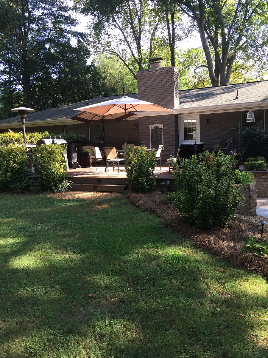 Backyard hot tub and deck with patio furniture