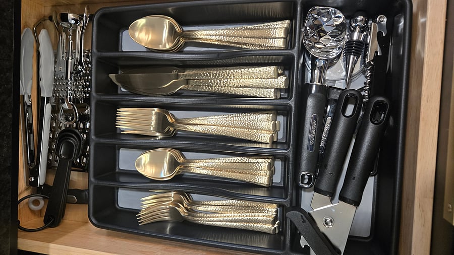 beautiful gold silverware and all the tools you need to enjoy your home away home