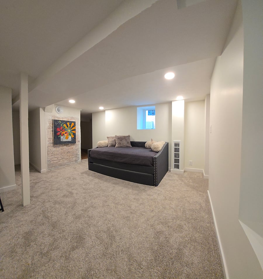 The basement has this versatile twin daybed with convenient pull out twin trundle underneath, providing two separate twin-sized beds. Walking closet. Desk and chair. Egress door to exit the house from the lower level.